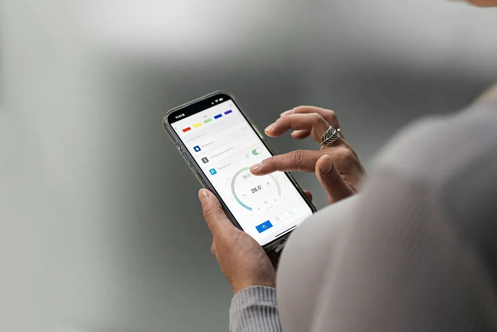 Hands using a mobile app