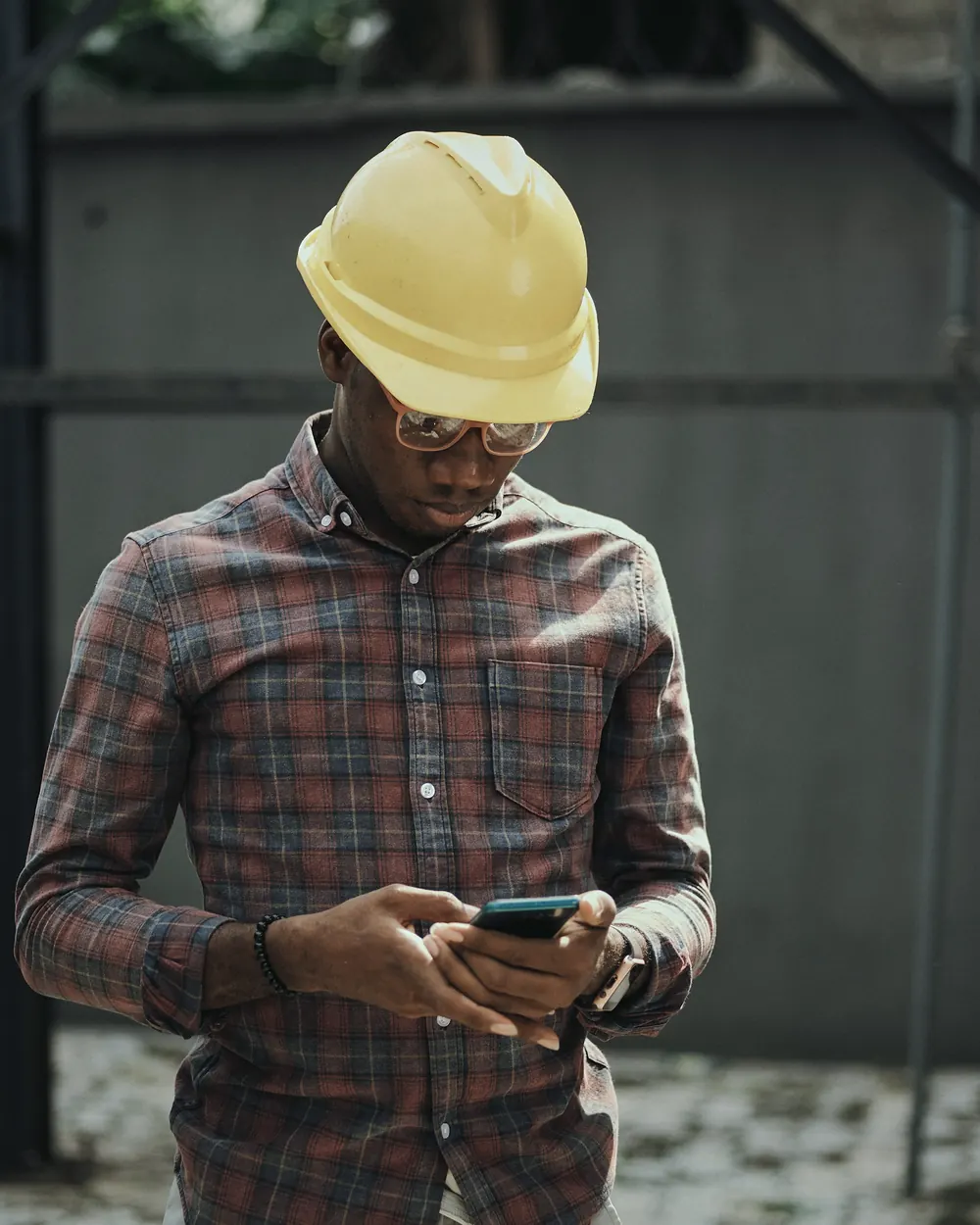 A site worker checking his phone